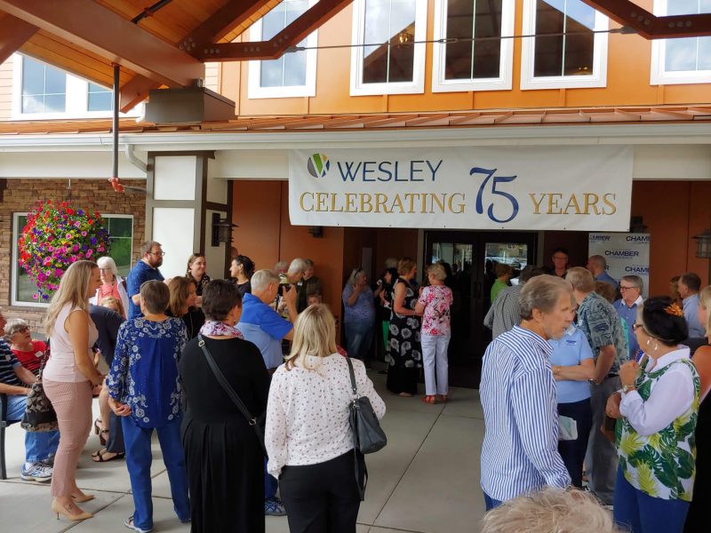 people celebrating 75 years in front of wesley tehaleh building 