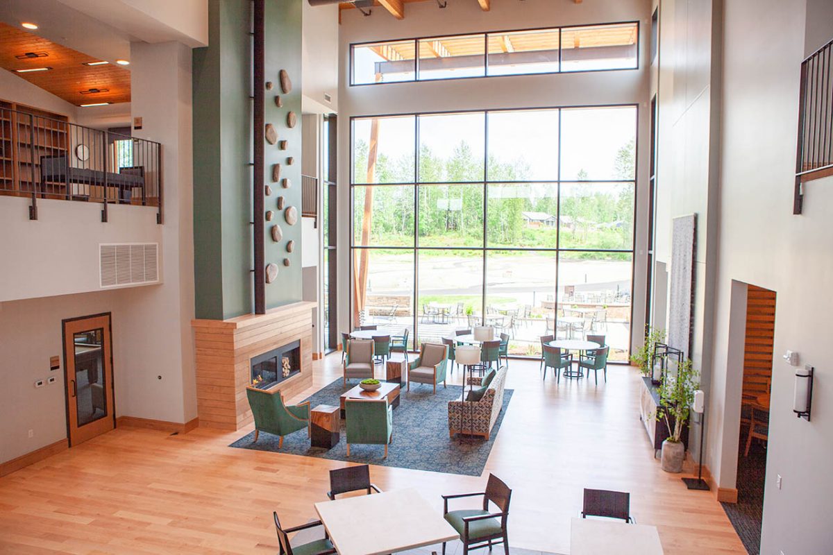 inside view of main lodge room with big windows and gathering area