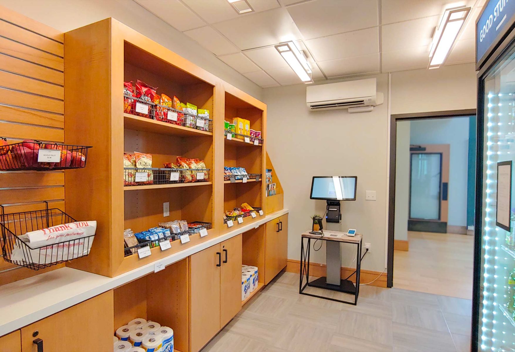 small store with shelves of food and sundry items