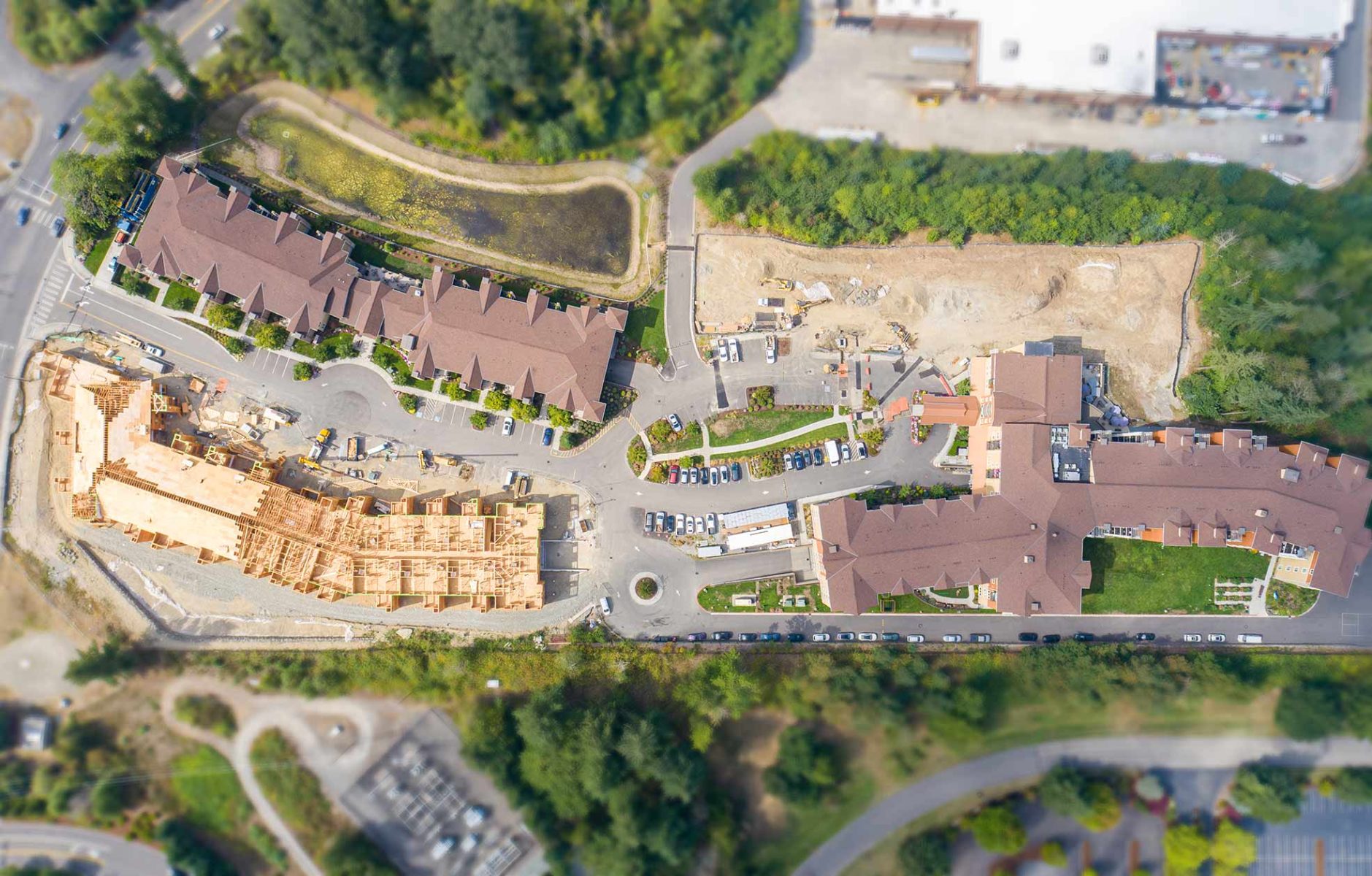 Aerial Photo of the Wesley Bradley Park campus with the East Brownstone under construction and the Care Center being prepared