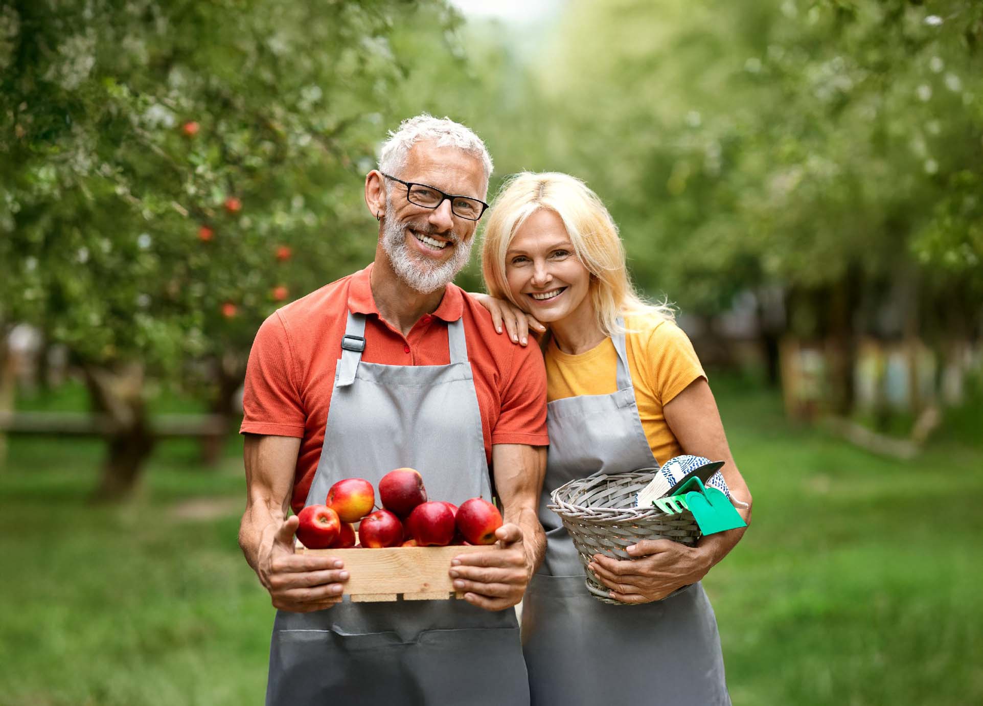 Older couple apple picking